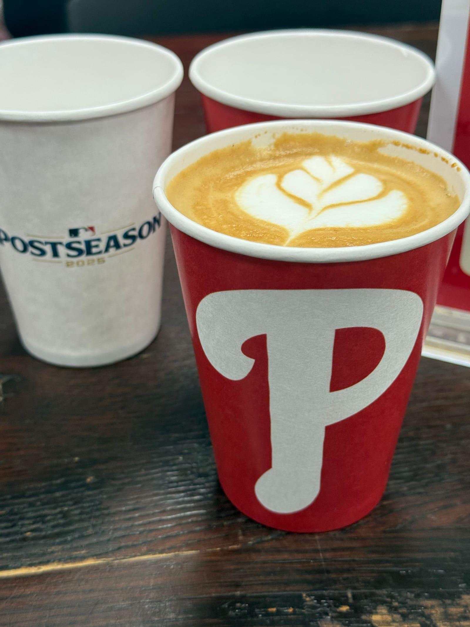 Lattes in red Phillies cups beside a white Postseason cup